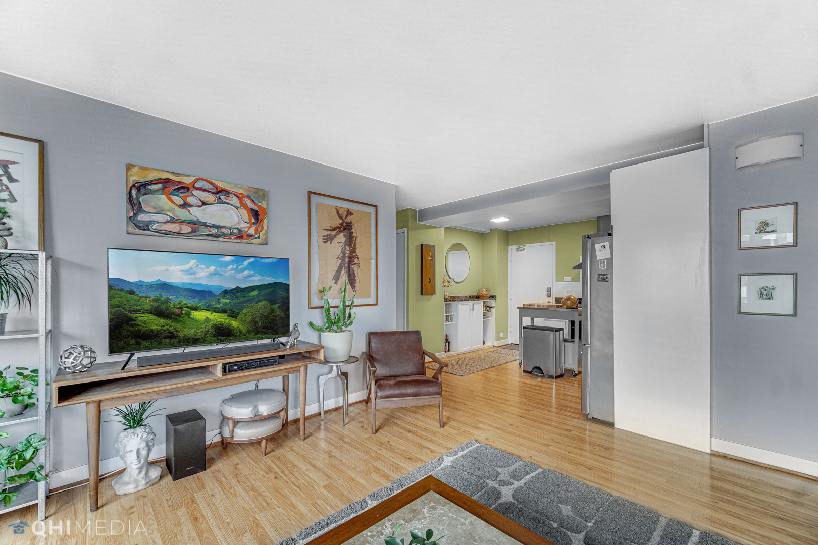 2909 North Sheridan Road, Unit 1502 Chicago, IL 60657 - Photo 7 of 19 a living room with furniture and a flat screen tv