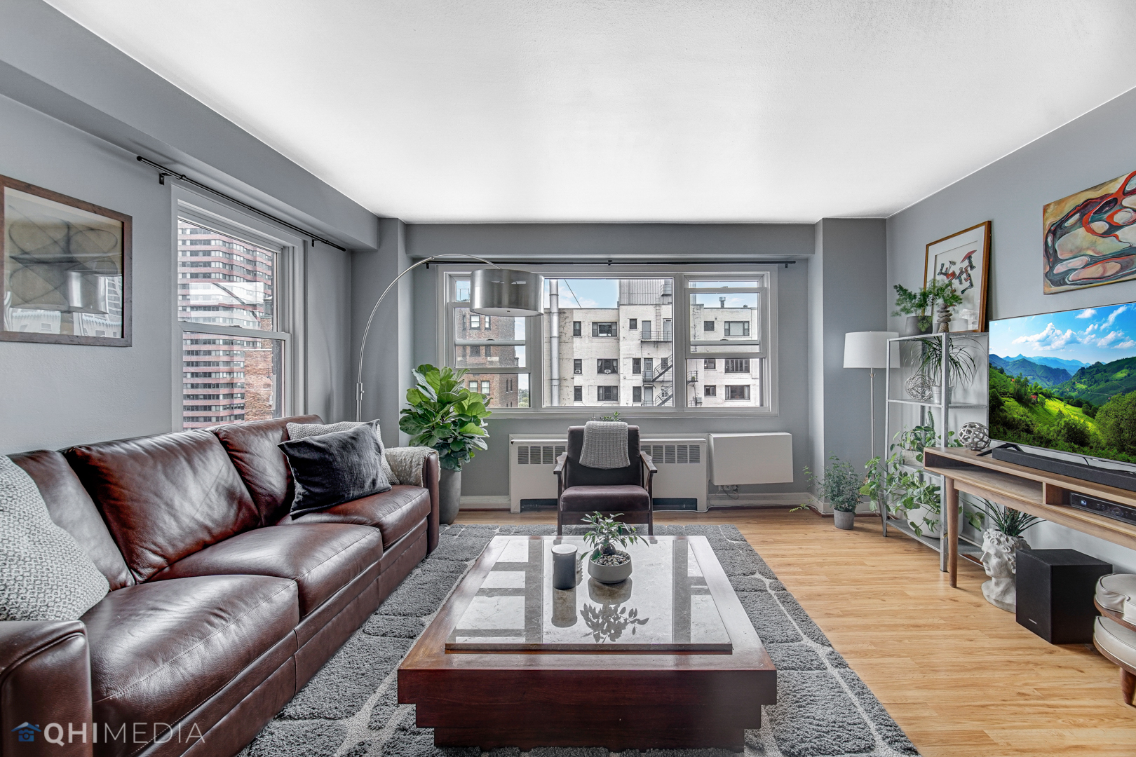 2909 North Sheridan Road, Unit 1502 Chicago, IL 60657 - Photo 8 of 19 a living room with furniture and a flat screen tv