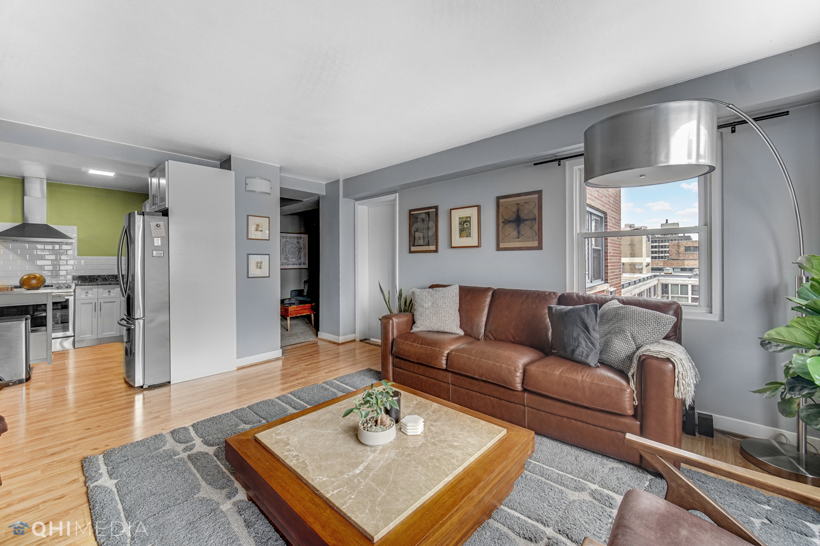 2909 North Sheridan Road, Unit 1502 Chicago, IL 60657 - Photo 9 of 19 a living room with furniture and a wooden floor