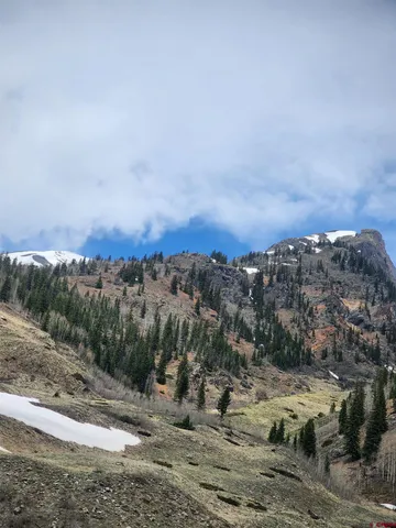 a view of a town with mountains in the background
