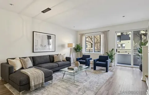 a living room with furniture and a window