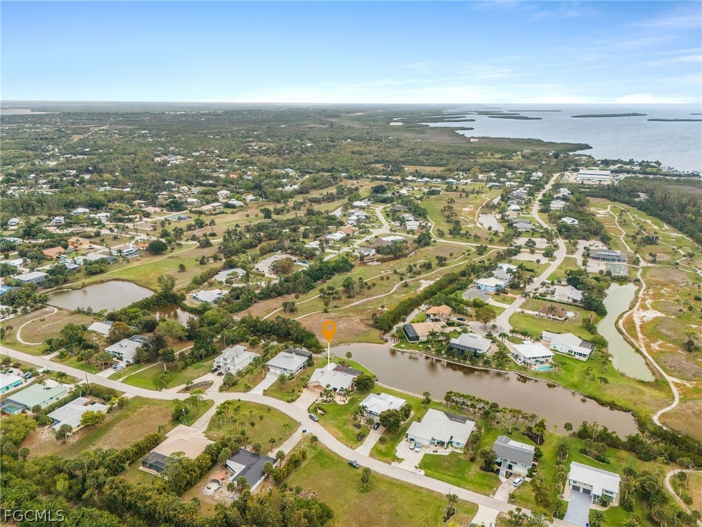 7747 Grande Pine Road Bokeelia, FL 33922 - Photo 45 of 45 an aerial view of residential building with parking space