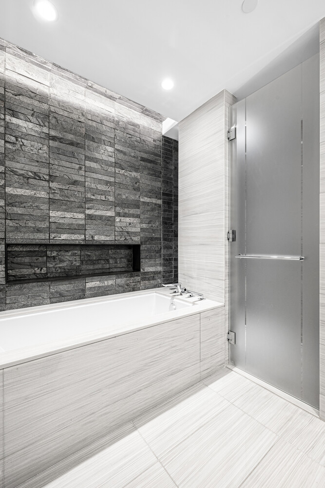 70 Charlton Street, Unit PHC Manhattan, NY 10014 - Photo 16 of 18 a bathroom with a bathtub and a shower