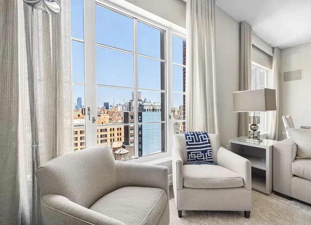 a living room with furniture and a window