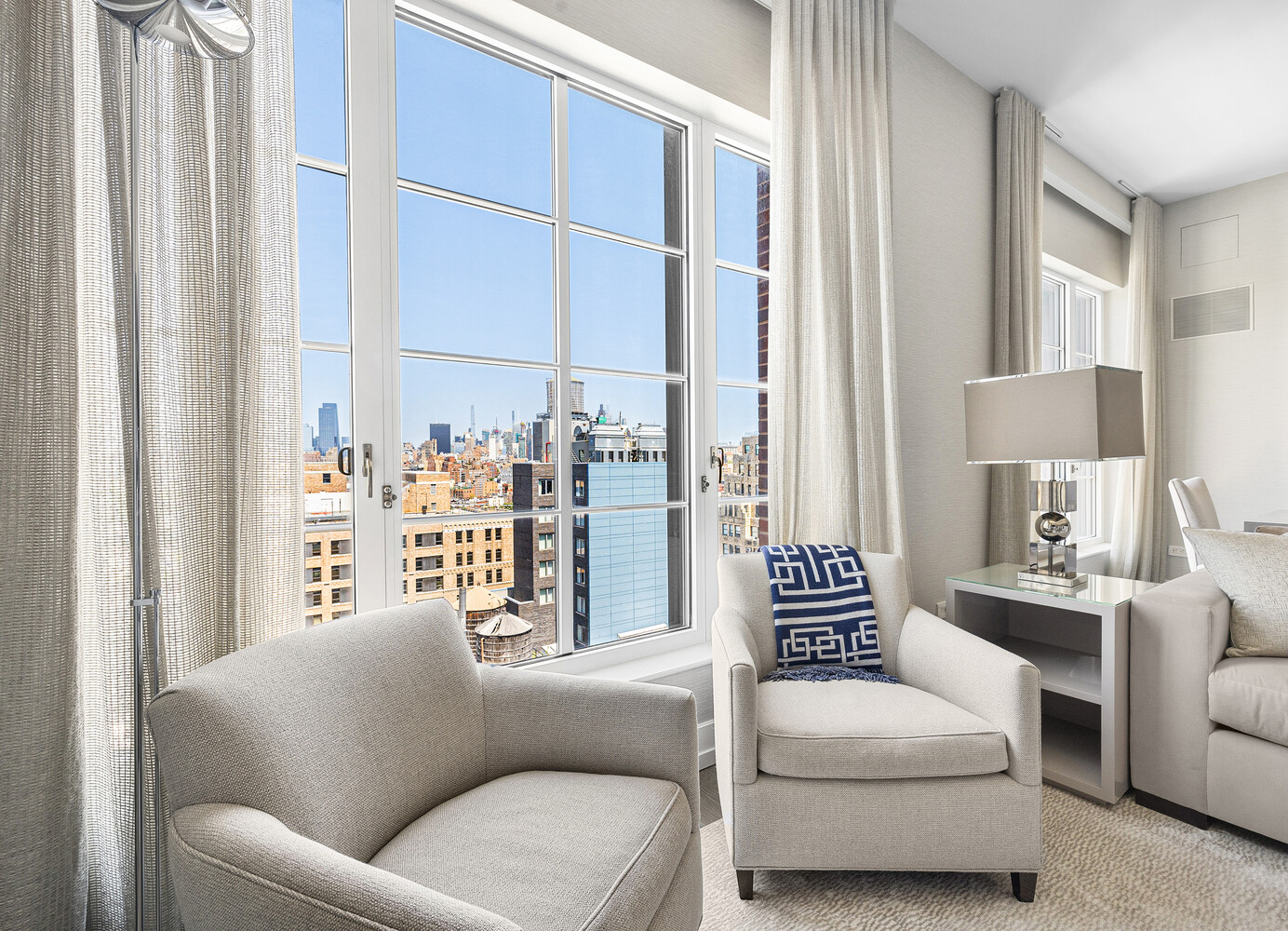 70 Charlton Street, Unit PHC Manhattan, NY 10014 - Photo 4 of 18 a living room with furniture and a window