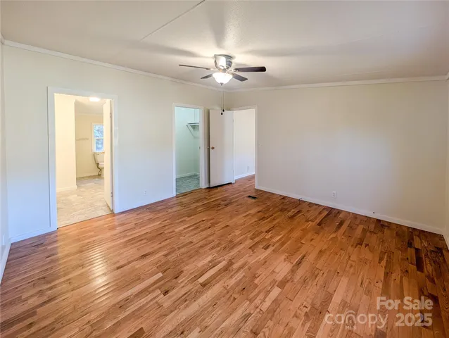 a view of a livingroom with a chandelier fan