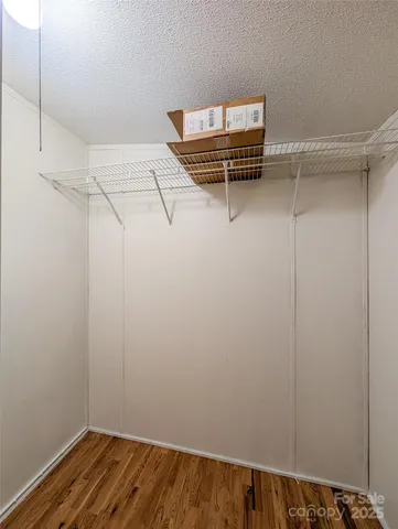 a view of a room with racks on the wall