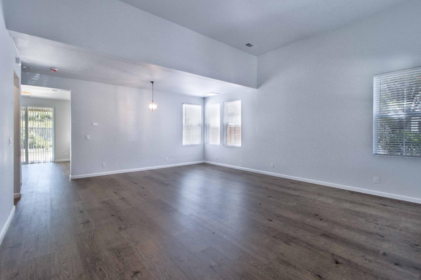 2715 Shellgate Circle Hayward, CA 94545 - Photo 4 of 47 an empty room with wooden floor and windows