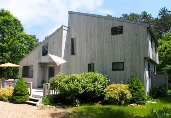 a aerial view of a house with a yard and plants