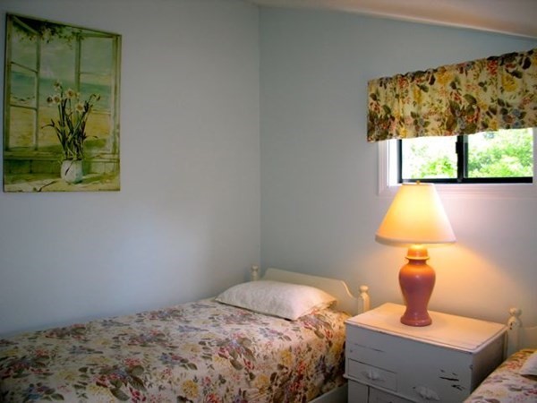 175 Meetinghouse Way Edgartown, MA 02539 - Photo 14 of 21 a bedroom with a bed and a window
