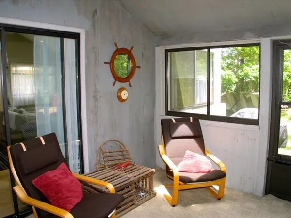 a living room with furniture and windows
