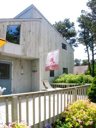 175 Meetinghouse Way Edgartown, MA 02539 - Photo 21 of 21 a front view of house with green space
