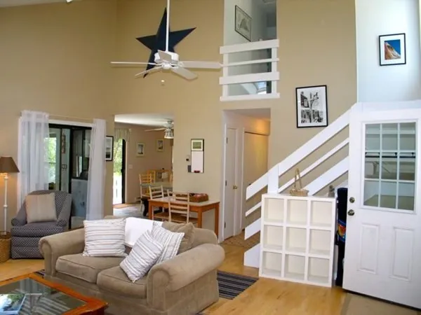 a living room with furniture and white walls