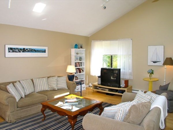 175 Meetinghouse Way Edgartown, MA 02539 - Photo 5 of 21 a living room with furniture and a flat screen tv