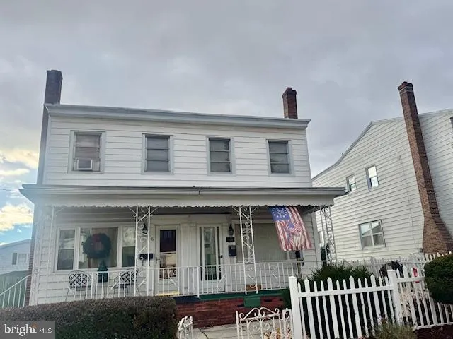 a front view of a house with glass windows