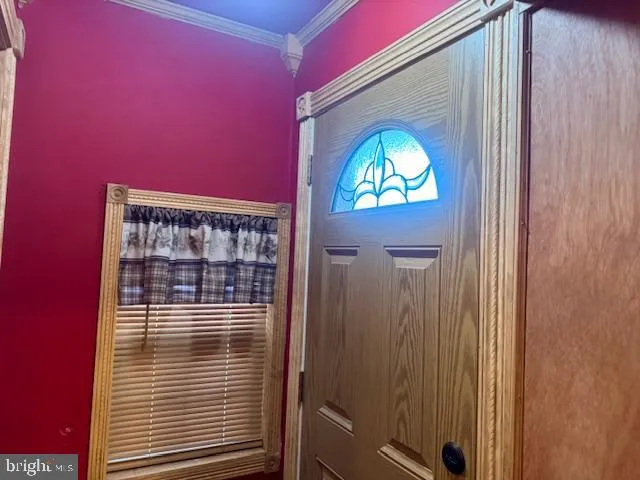 a kitchen with granite countertop a refrigerator and a sink