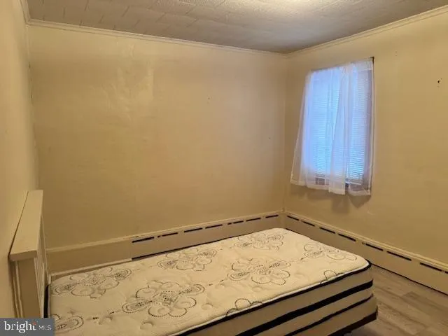 a bathroom with a toilet a sink and shower