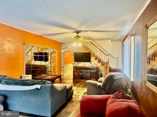a view of a hallway with couches and painted walls