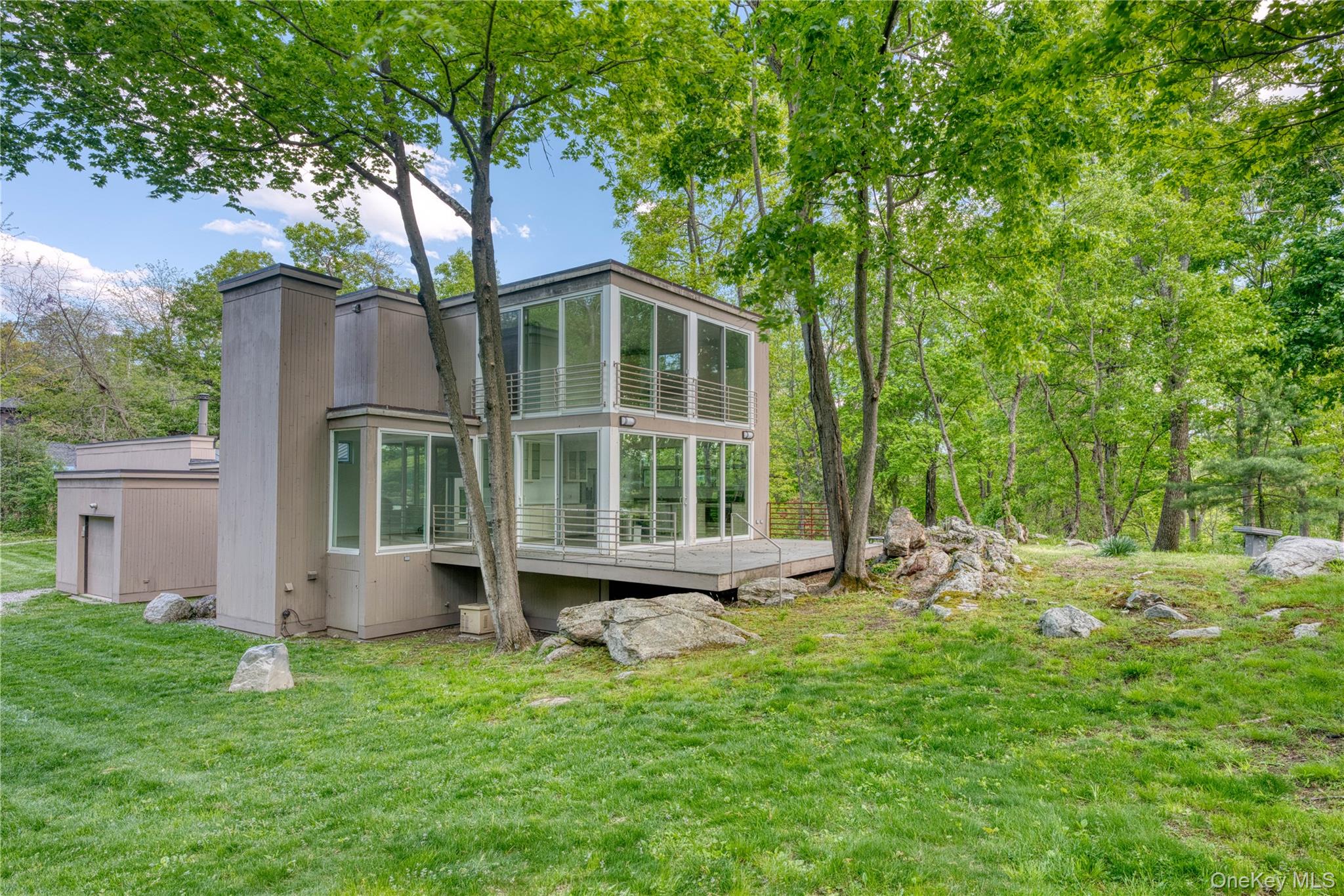 61 Indian Brook Road Garrison, NY 10524 - Photo 3 of 23 a front view of house with yard and green space