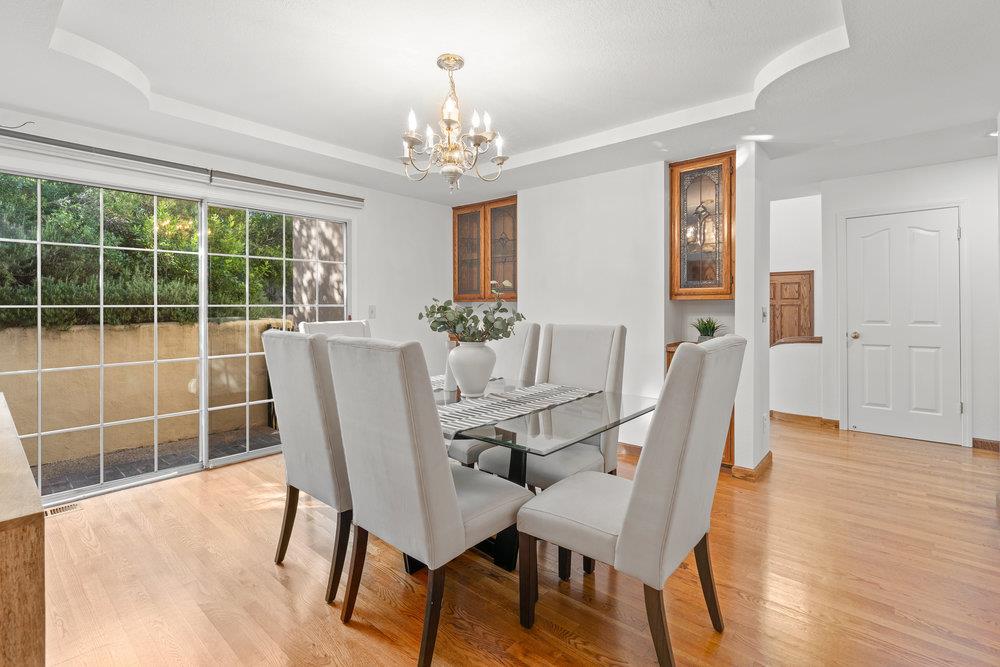 10930 Miramonte Road Cupertino, CA 95014 - Photo 11 of 50 a view of a dining room with furniture window and wooden floor