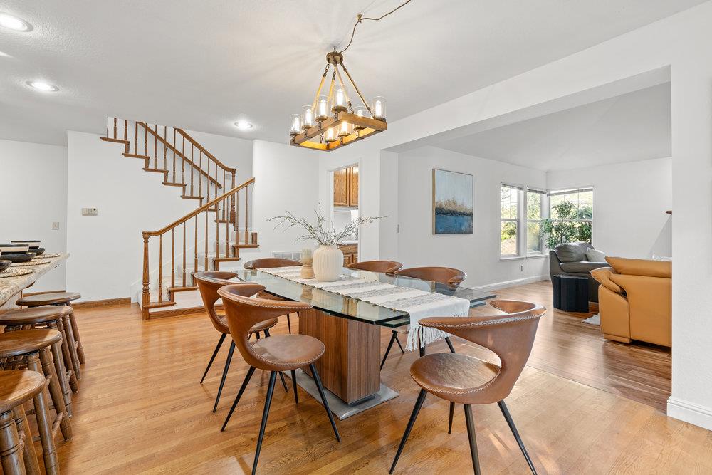 10930 Miramonte Road Cupertino, CA 95014 - Photo 22 of 50 a view of a dining room with furniture window and wooden floor