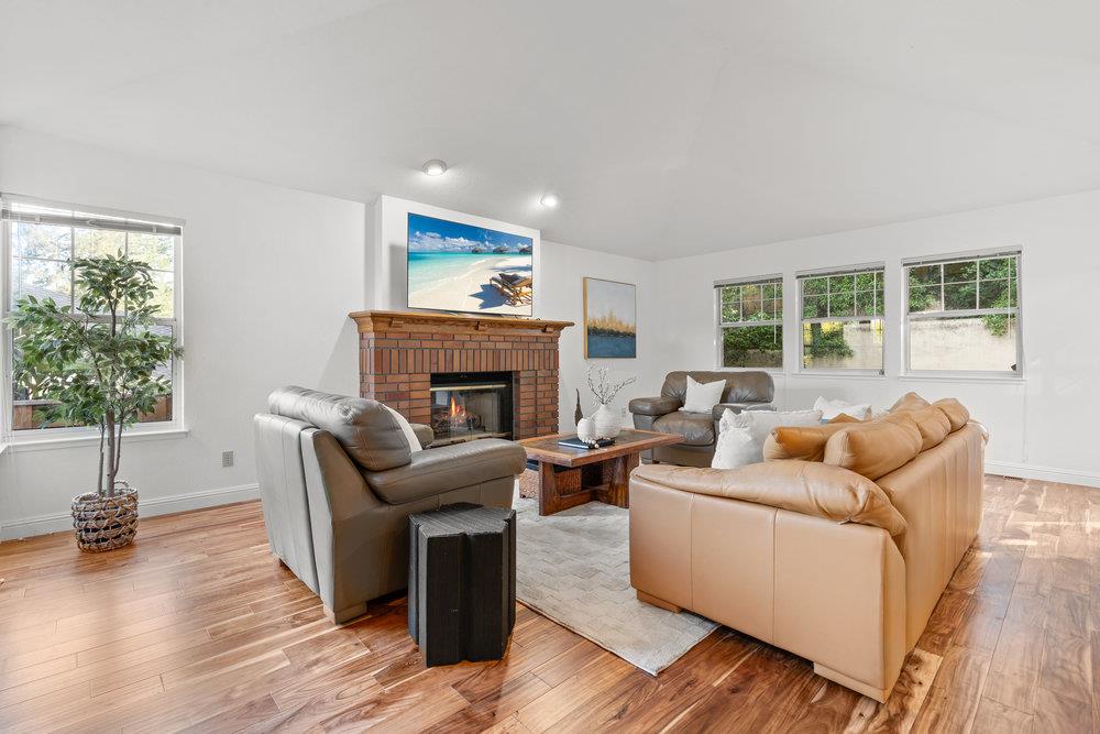 10930 Miramonte Road Cupertino, CA 95014 - Photo 24 of 50 a living room with furniture and a fireplace