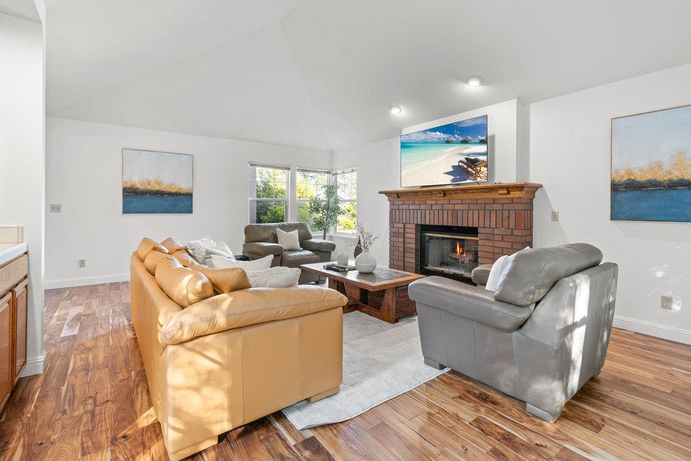 10930 Miramonte Road Cupertino, CA 95014 - Photo 25 of 50 a living room with furniture and a fireplace