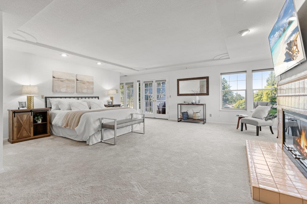 10930 Miramonte Road Cupertino, CA 95014 - Photo 27 of 50 a bed room with furniture and a fireplace