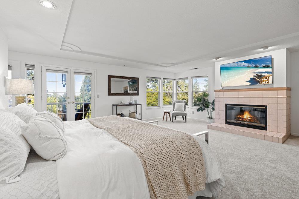10930 Miramonte Road Cupertino, CA 95014 - Photo 28 of 50 a bed room with a bed and a fireplace