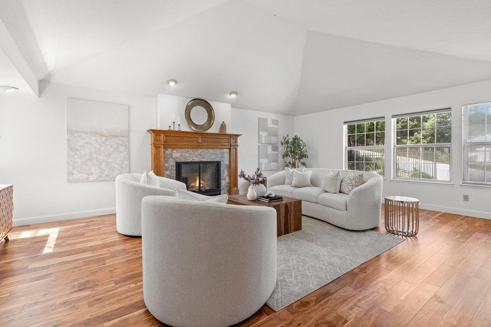 10930 Miramonte Road Cupertino, CA 95014 - Photo 3 of 50 a living room with furniture and a fireplace