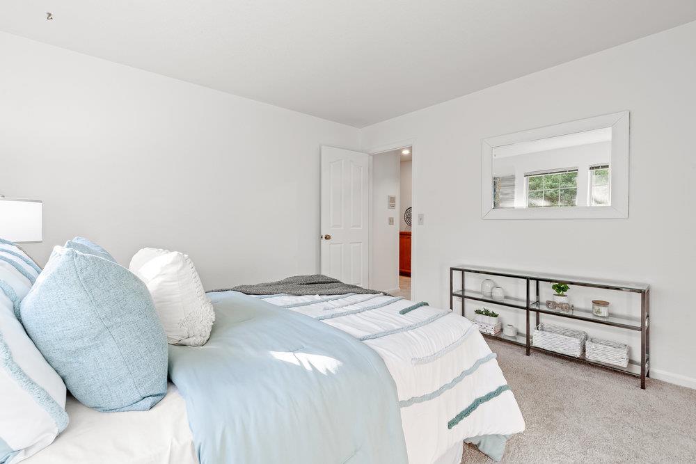 10930 Miramonte Road Cupertino, CA 95014 - Photo 35 of 50 a bedroom with a bed and a window