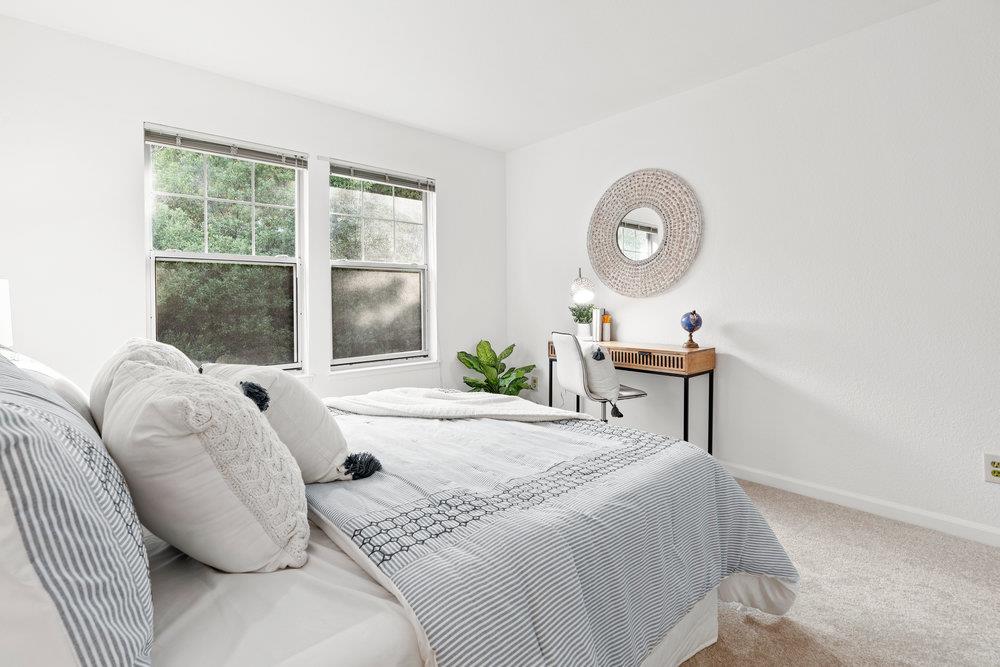 10930 Miramonte Road Cupertino, CA 95014 - Photo 38 of 50 a bed sitting in a bedroom next to a window