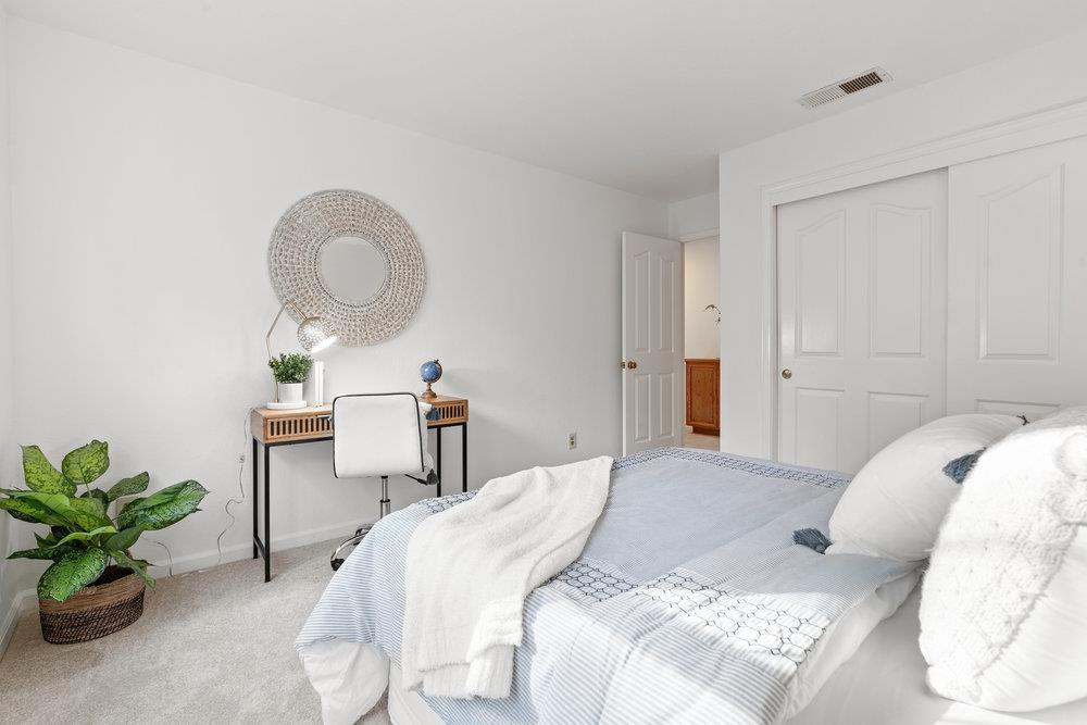 10930 Miramonte Road Cupertino, CA 95014 - Photo 39 of 50 a bedroom with a bed and a potted plant