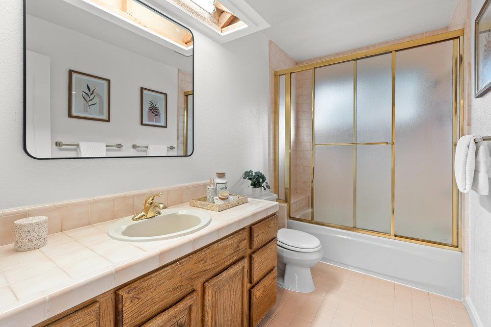10930 Miramonte Road Cupertino, CA 95014 - Photo 40 of 50 a bathroom with a sink toilet and a mirror
