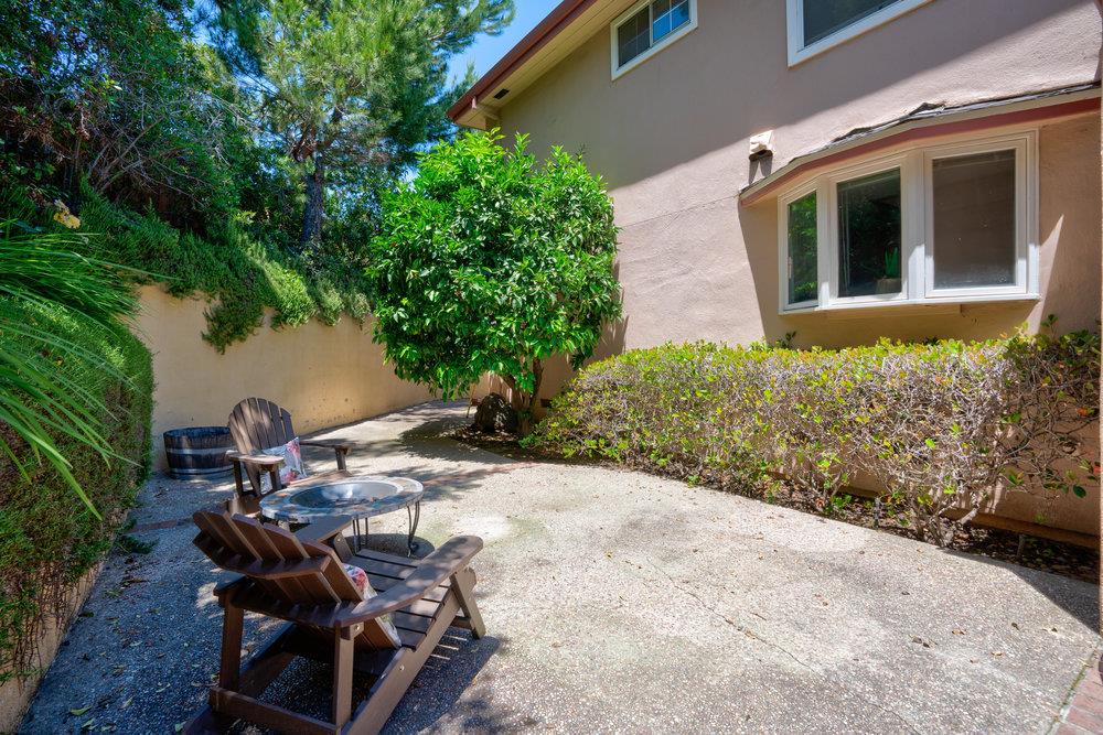 10930 Miramonte Road Cupertino, CA 95014 - Photo 42 of 50 a view of a backyard with table and chairs and potted plants
