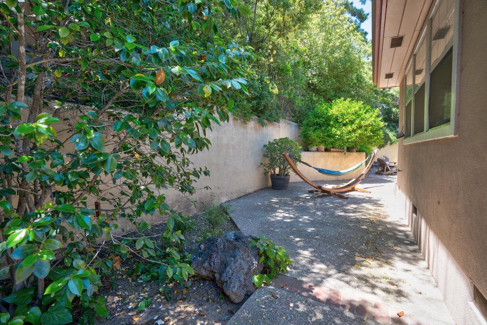 10930 Miramonte Road Cupertino, CA 95014 - Photo 45 of 50 a view of a backyard with plants and garden