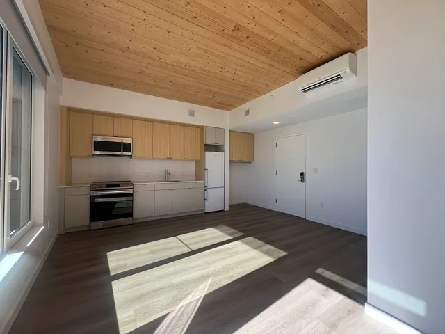 a kitchen with a sink and stainless steel appliances