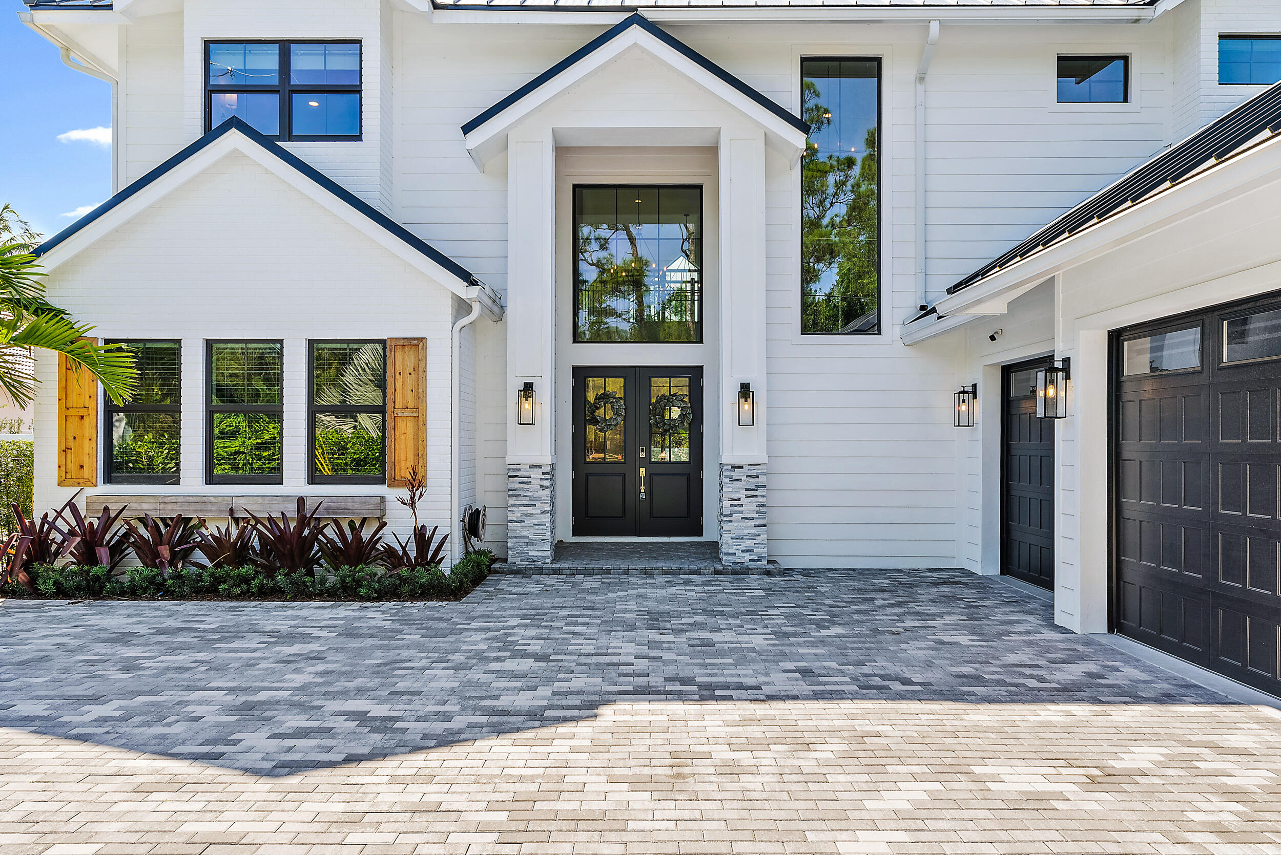 18764 Southeast Jupiter River Drive Jupiter, FL 33458 - Photo 15 of 67 a front view of a house
