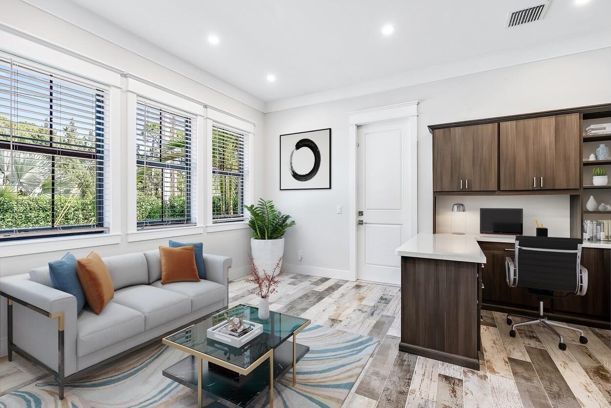 18764 Southeast Jupiter River Drive Jupiter, FL 33458 - Photo 25 of 67 a living room with furniture a dining table and a potted plant