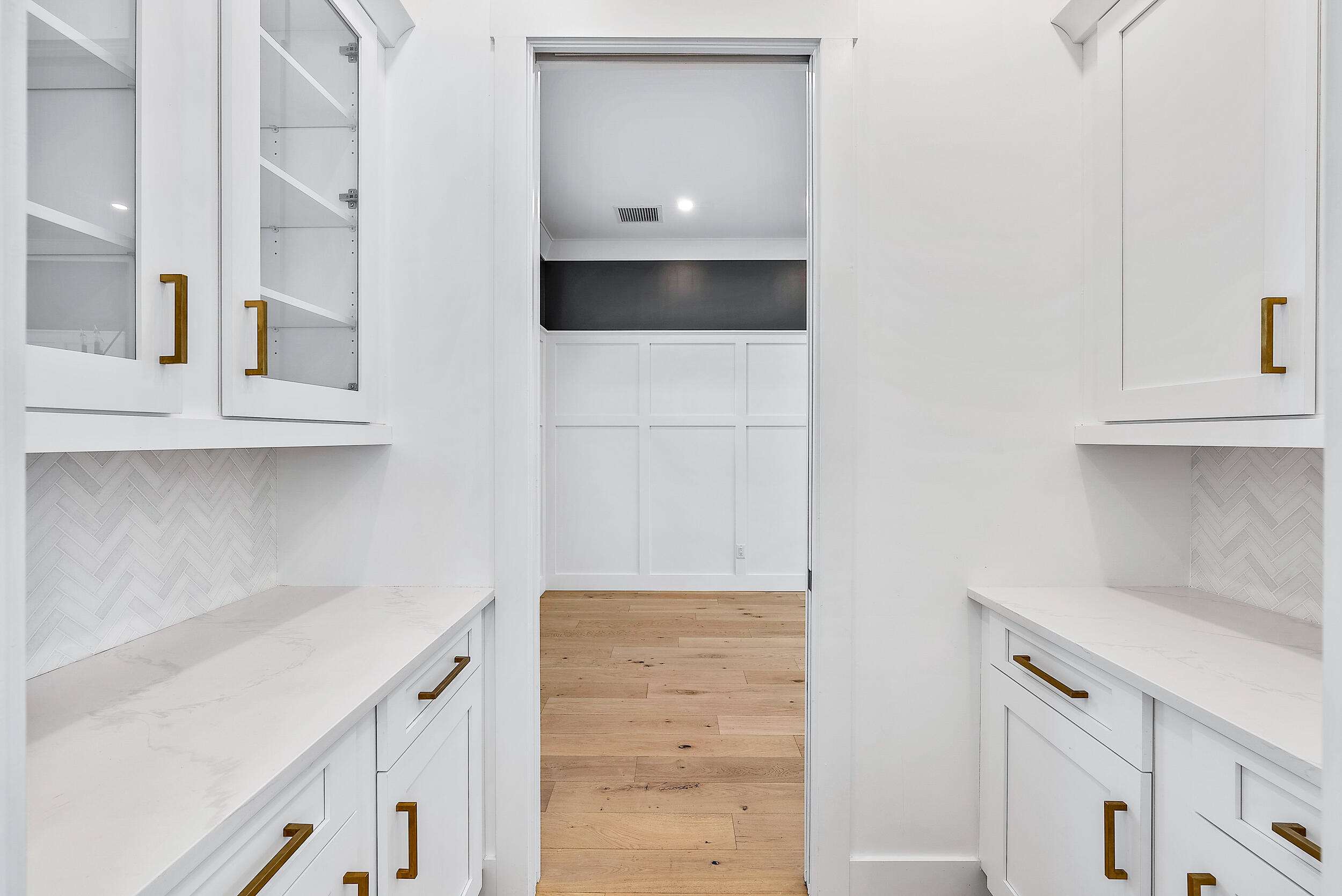 18764 Southeast Jupiter River Drive Jupiter, FL 33458 - Photo 27 of 67 a kitchen with a sink and cabinets