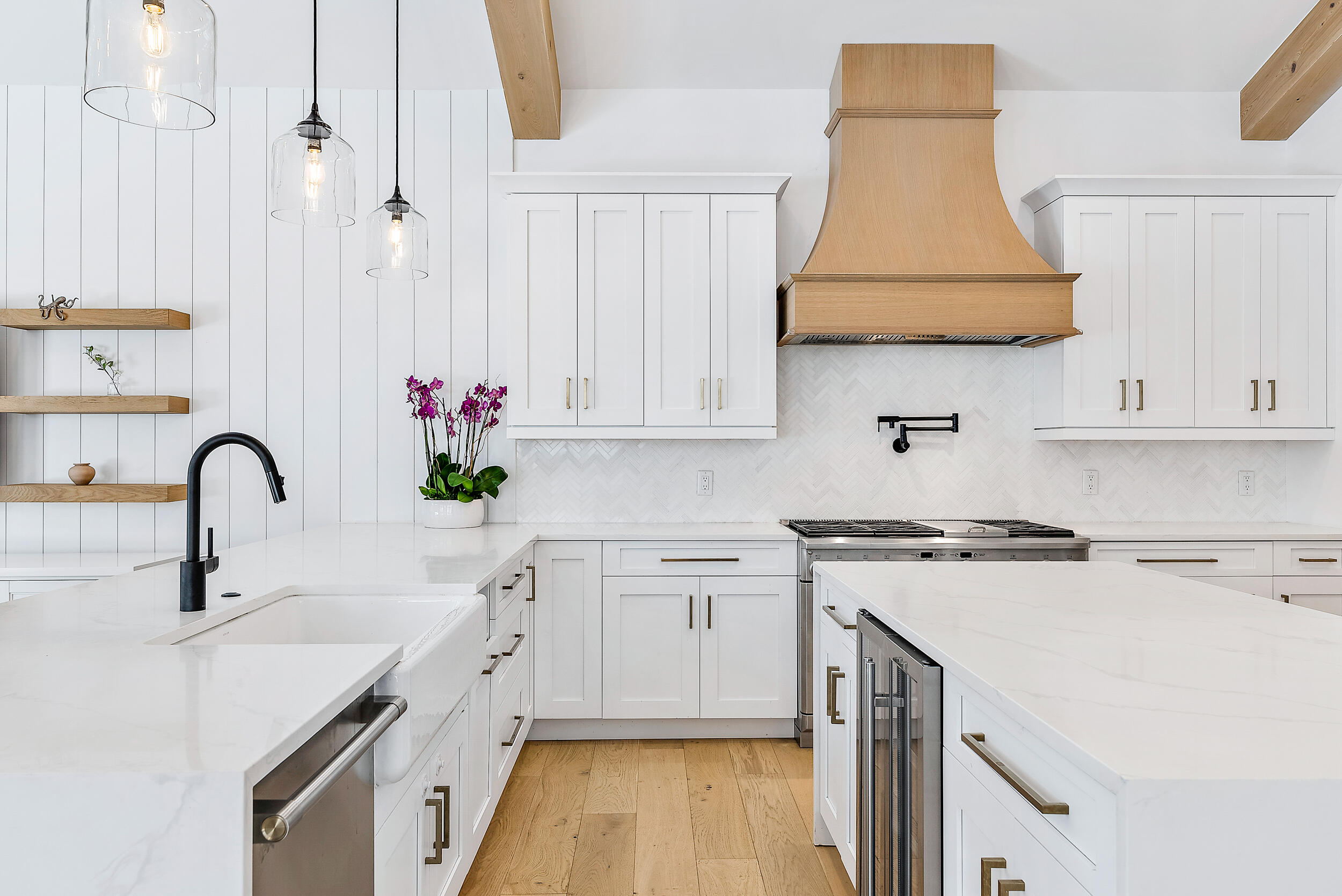 18764 Southeast Jupiter River Drive Jupiter, FL 33458 - Photo 28 of 67 a kitchen with stainless steel appliances a sink a stove and white cabinets