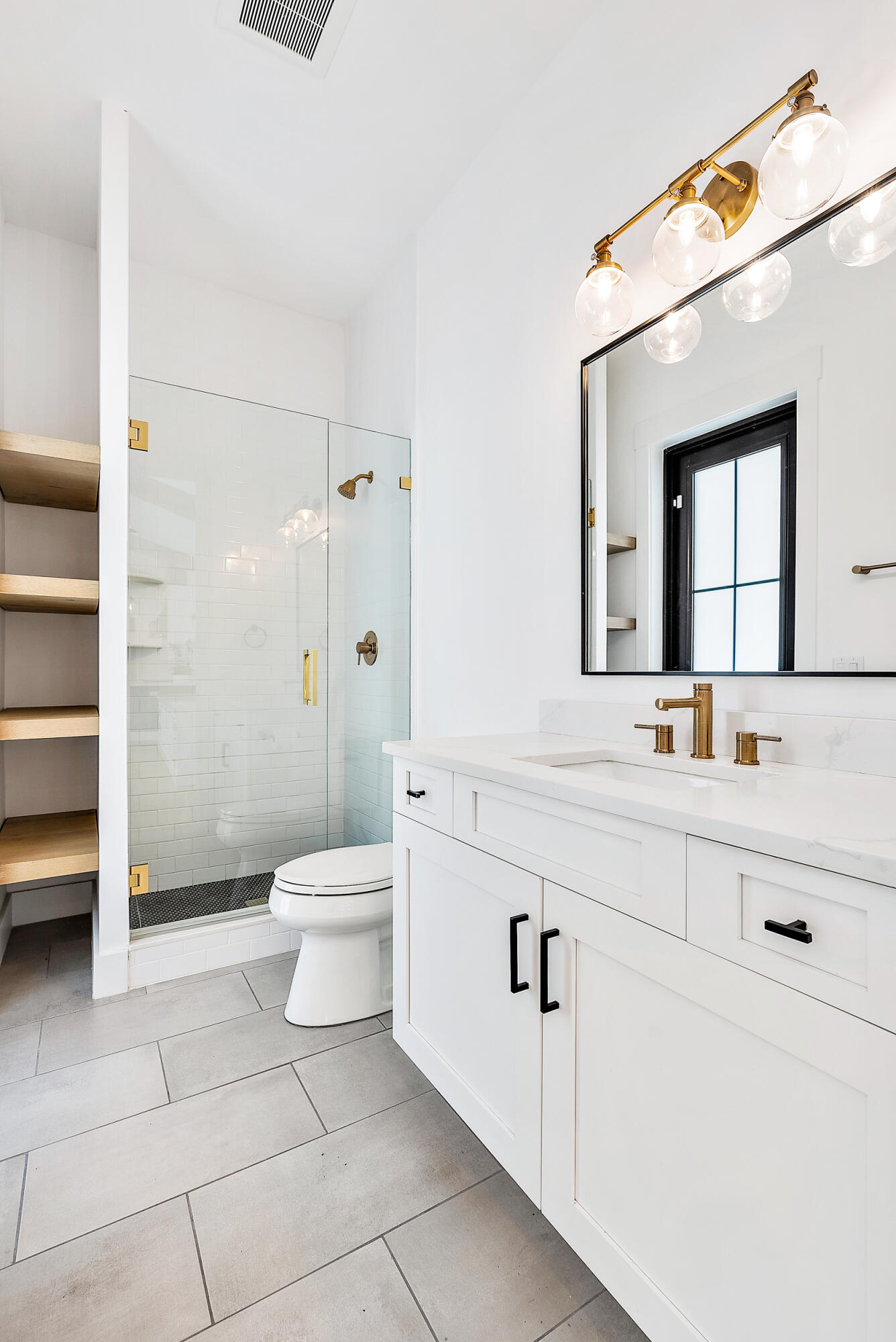 18764 Southeast Jupiter River Drive Jupiter, FL 33458 - Photo 35 of 67 a bathroom with a toilet a sink a mirror and a shower