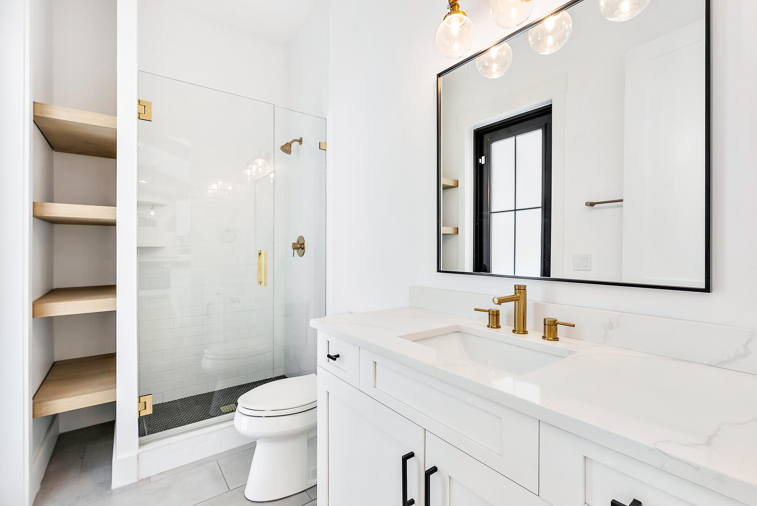 18764 Southeast Jupiter River Drive Jupiter, FL 33458 - Photo 36 of 67 a bathroom with a sink a toilet and shower