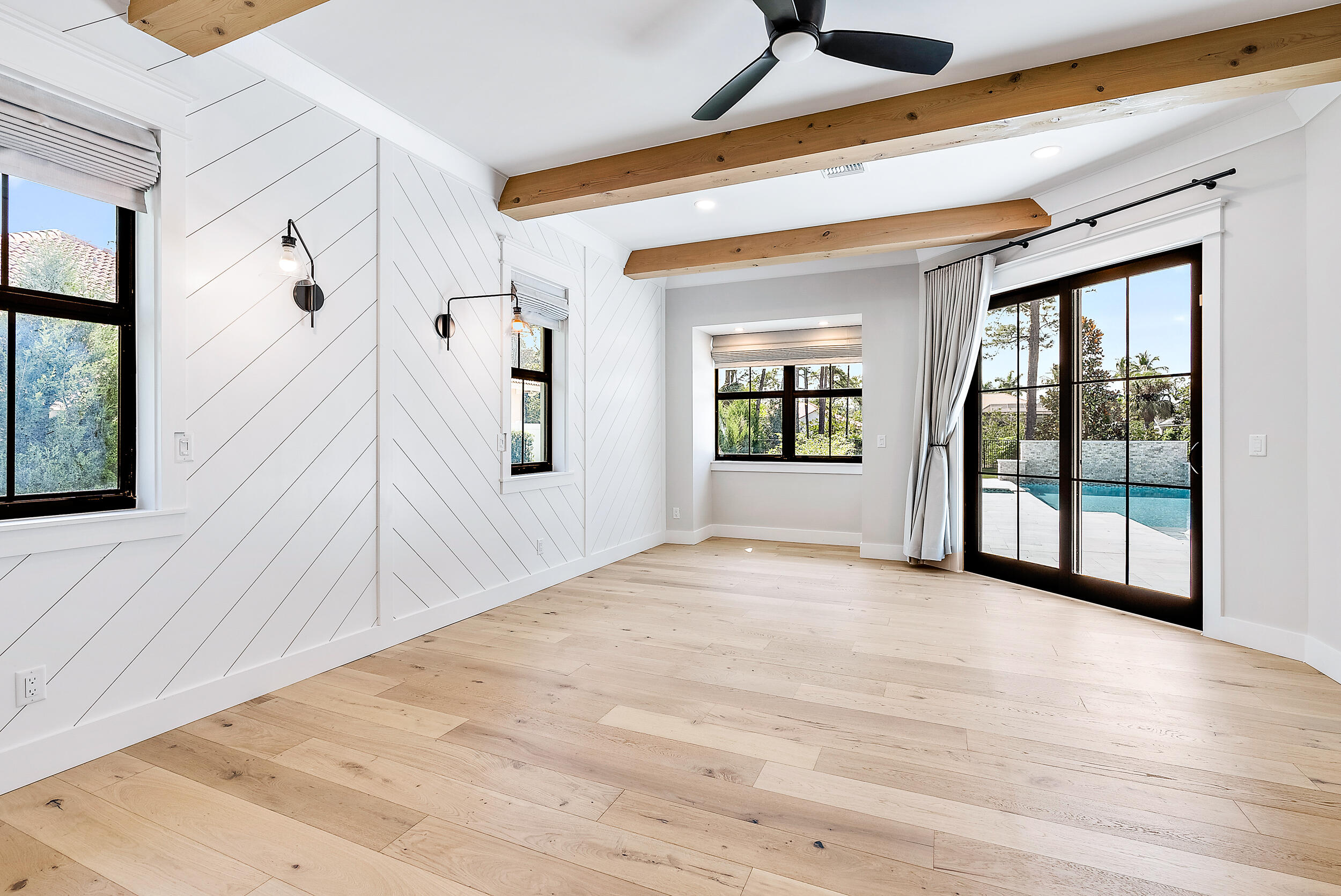 18764 Southeast Jupiter River Drive Jupiter, FL 33458 - Photo 38 of 67 a view of a hallway with wooden floor and a fireplace