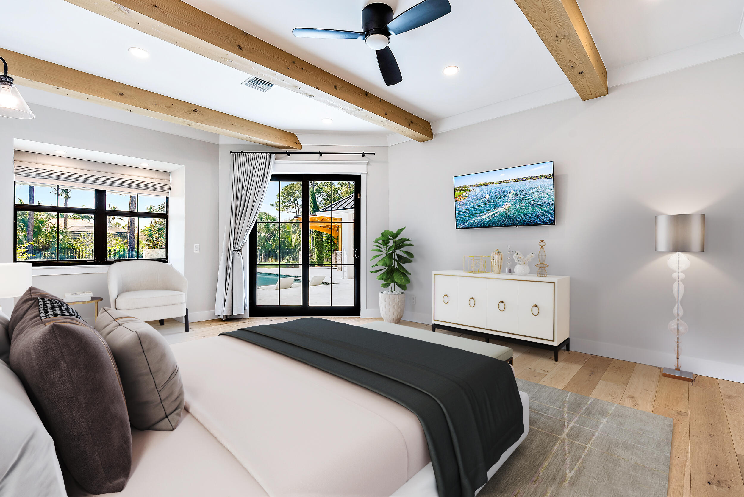 18764 Southeast Jupiter River Drive Jupiter, FL 33458 - Photo 39 of 67 a bedroom with a bed couch and window