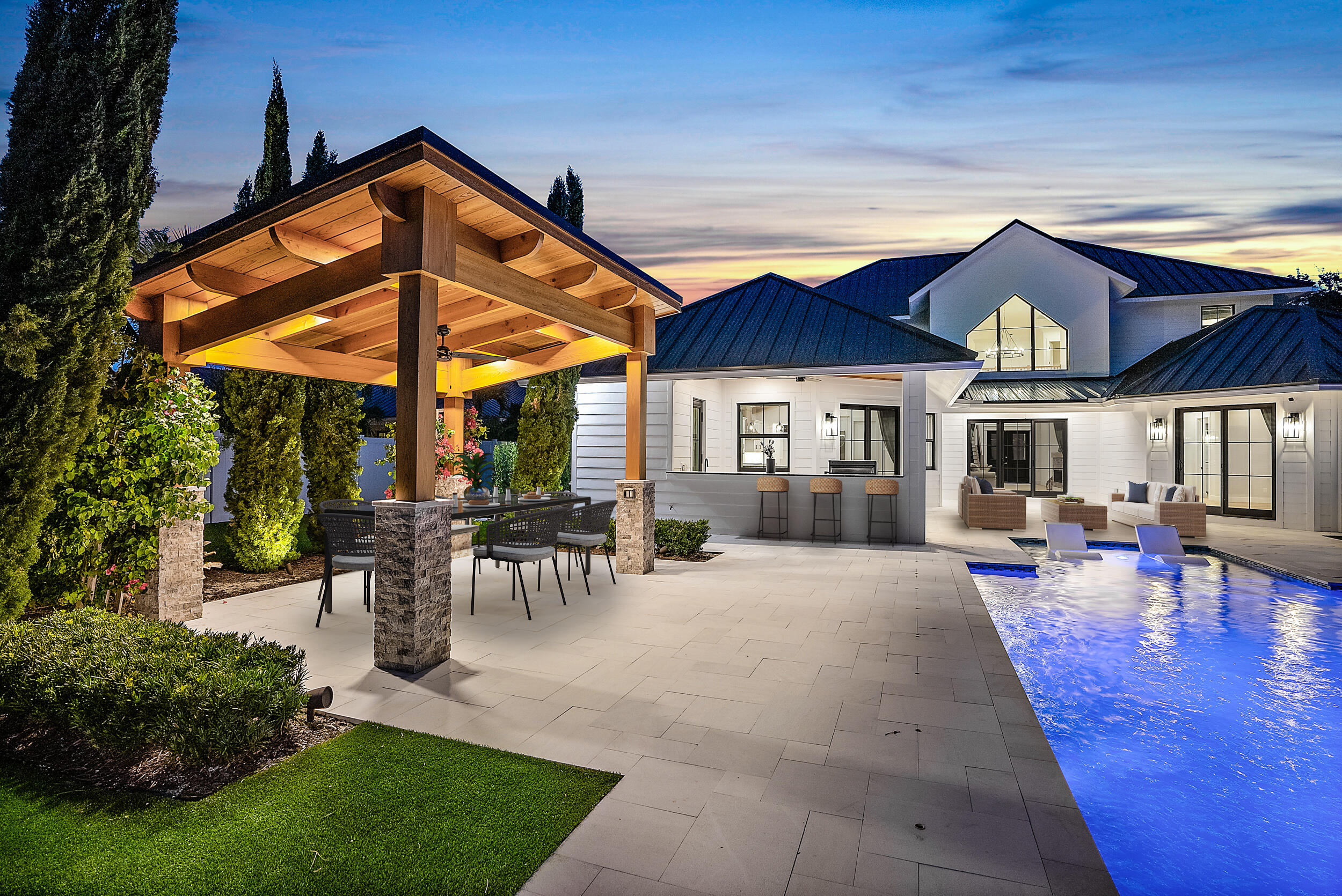 18764 Southeast Jupiter River Drive Jupiter, FL 33458 - Photo 6 of 67 a view of patio with a table and chairs under an umbrella