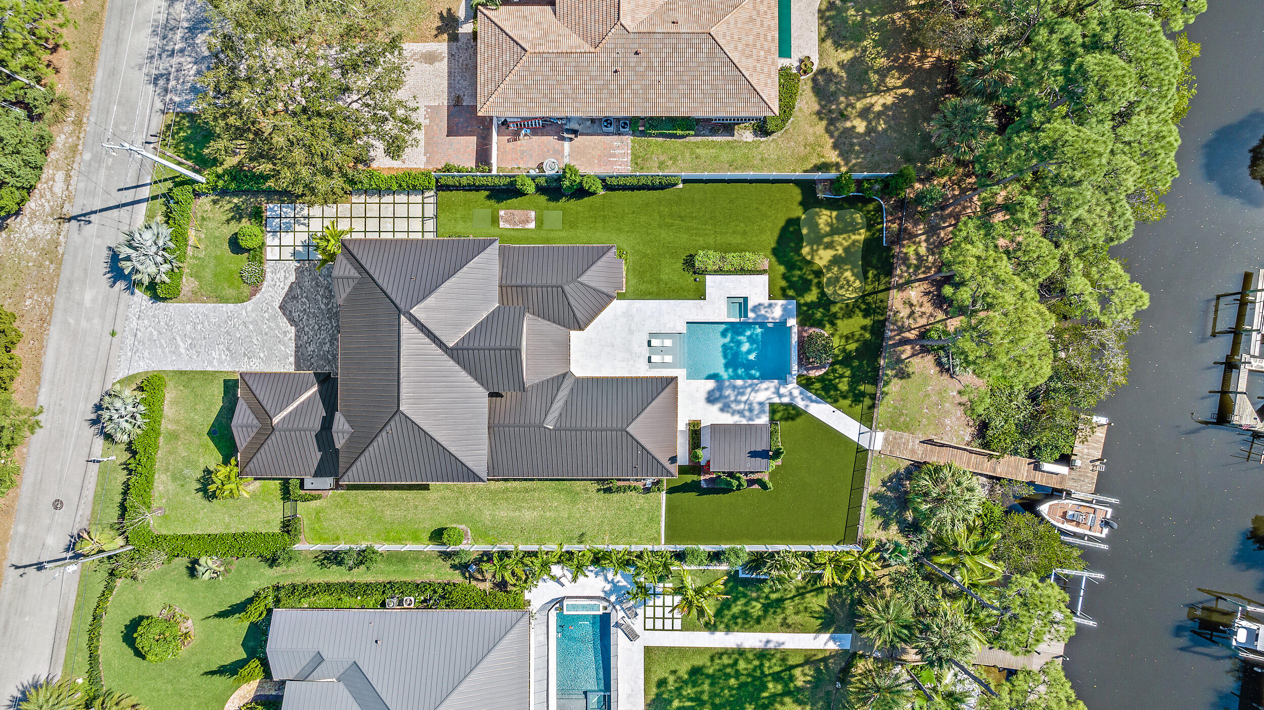 18764 Southeast Jupiter River Drive Jupiter, FL 33458 - Photo 63 of 67 an aerial view of a house with garden space and street view