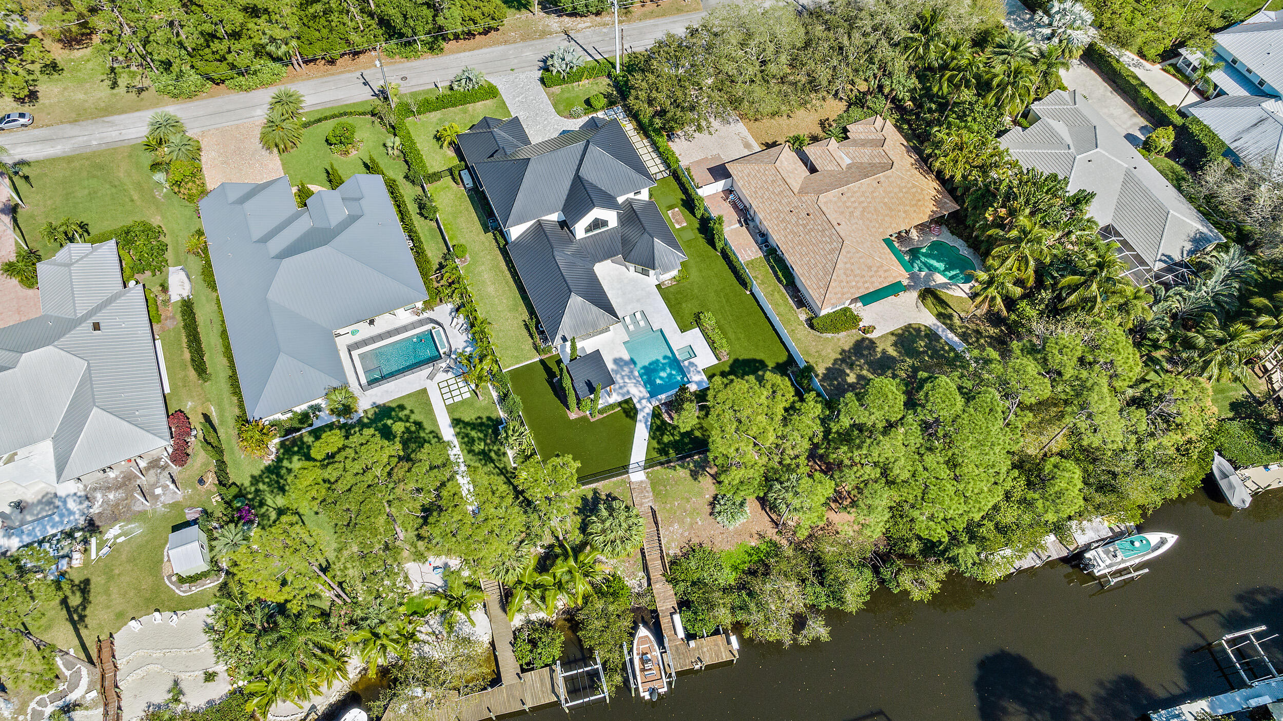 18764 Southeast Jupiter River Drive Jupiter, FL 33458 - Photo 64 of 67 an aerial view of a house with a yard swimming pool and outdoor seating