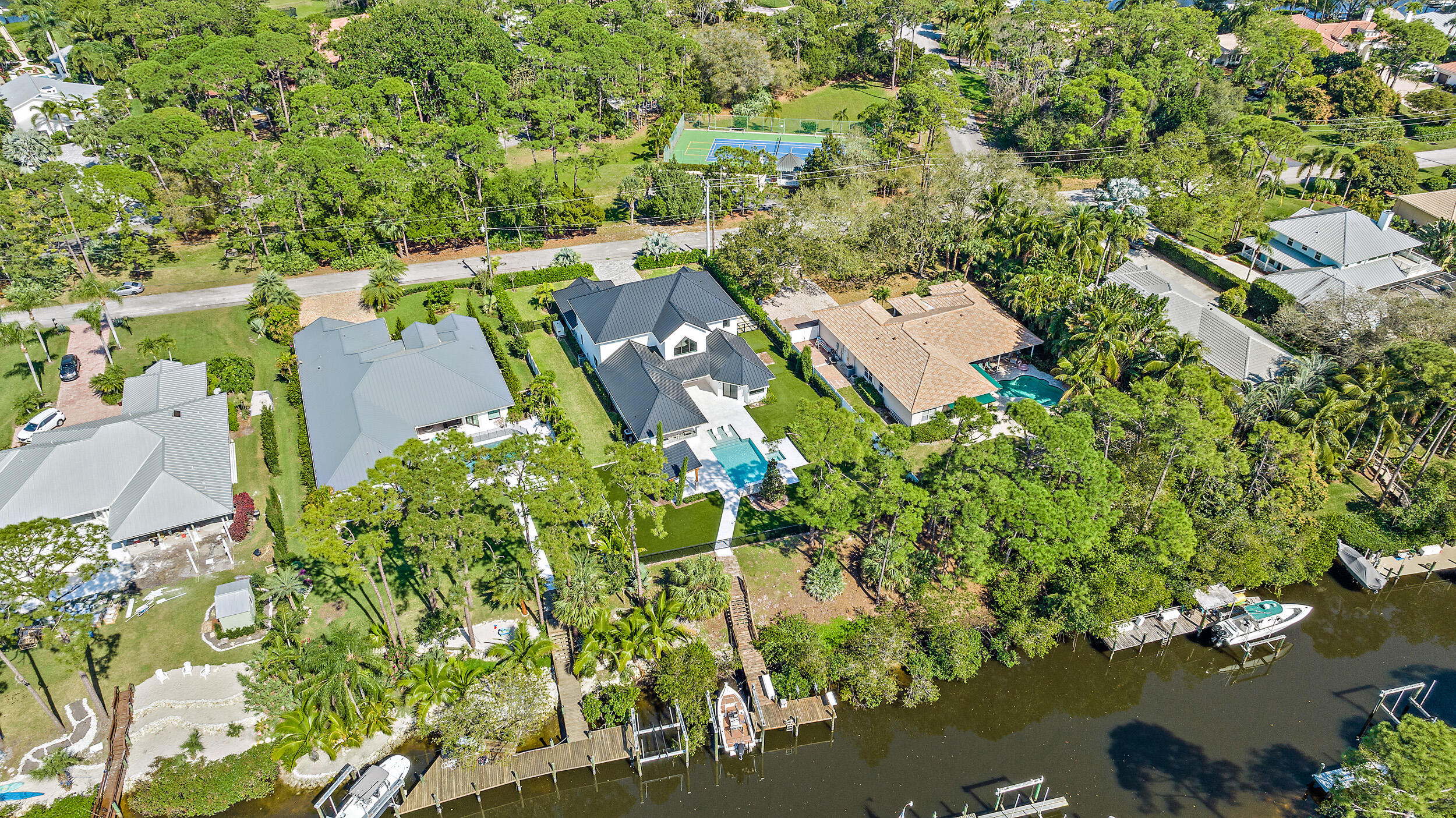 18764 Southeast Jupiter River Drive Jupiter, FL 33458 - Photo 65 of 67 an aerial view of a house with a yard and lake view