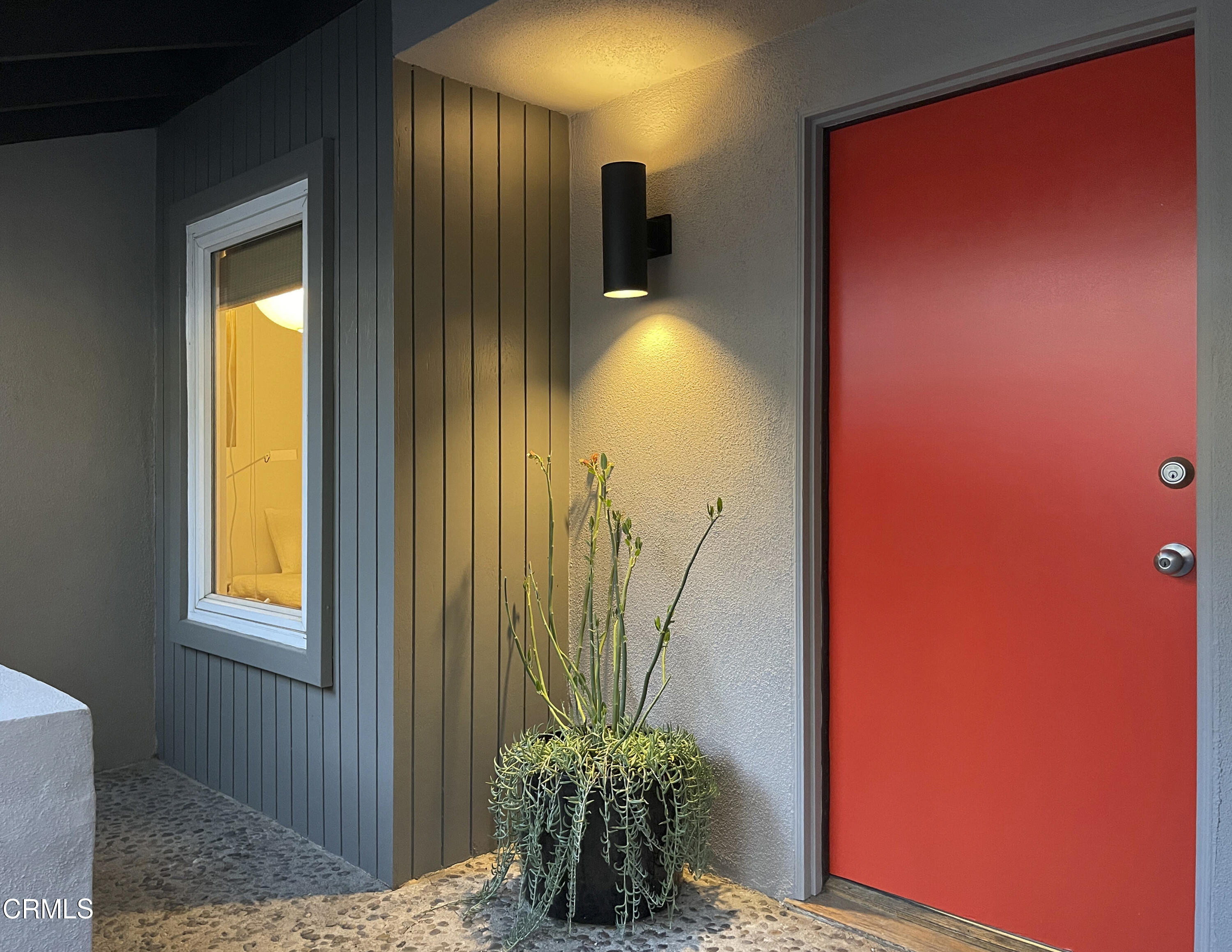 a vase of flowers sitting next to a window